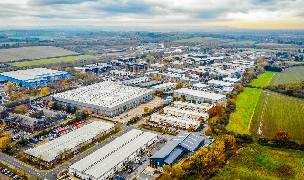 Commercial Property Management image of a drone overshot of a commercial complex with surrounding fields