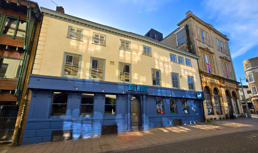 Prominent Queen Street Venue Secures New Let in Norwich City Centre - image of building on Queen Street with old BrewDog sign