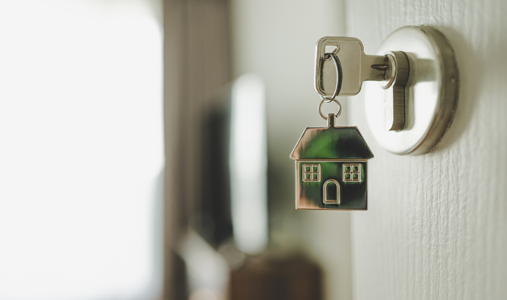 Why Landlords Renting to Friends or Family Must Still Follow the Rules - image of a house key in an open door