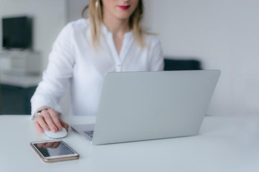 woman using silver laptop web