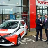 Clive Hedges right of Arnolds Keys and Damian Pavy of Dingles Toyota with one of the new Toyota Aygos