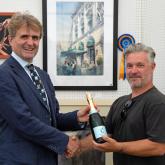 Guy Gowing of Arnolds Keys left with winning artist Colin Revell sm