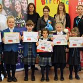 Hethersett Old Hall School pupils receive their certificates from Arnolds Keys