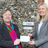 NDAEA chair Jan Hytch left presents a cheque to Jo Gillies Wheatley of St Martins Housing Trust 500px