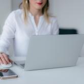 woman using silver laptop web