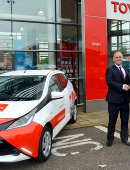 Clive Hedges right of Arnolds Keys and Damian Pavy of Dingles Toyota with one of the new Toyota Aygos