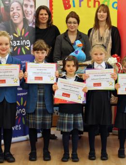Hethersett Old Hall School pupils receive their certificates from Arnolds Keys